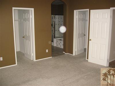 67698 Rio Arapaho Road Cathedral City, CA 92234 - Photo 5 of 11 an empty room with windows