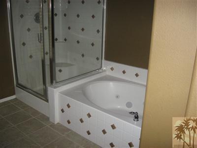 67698 Rio Arapaho Road Cathedral City, CA 92234 - Photo 7 of 11 a bathroom with a bathtub and shower