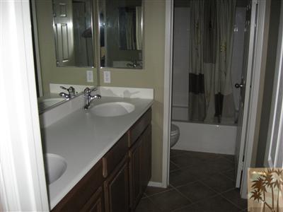 67698 Rio Arapaho Road Cathedral City, CA 92234 - Photo 9 of 11 a bathroom with a sink and a mirror