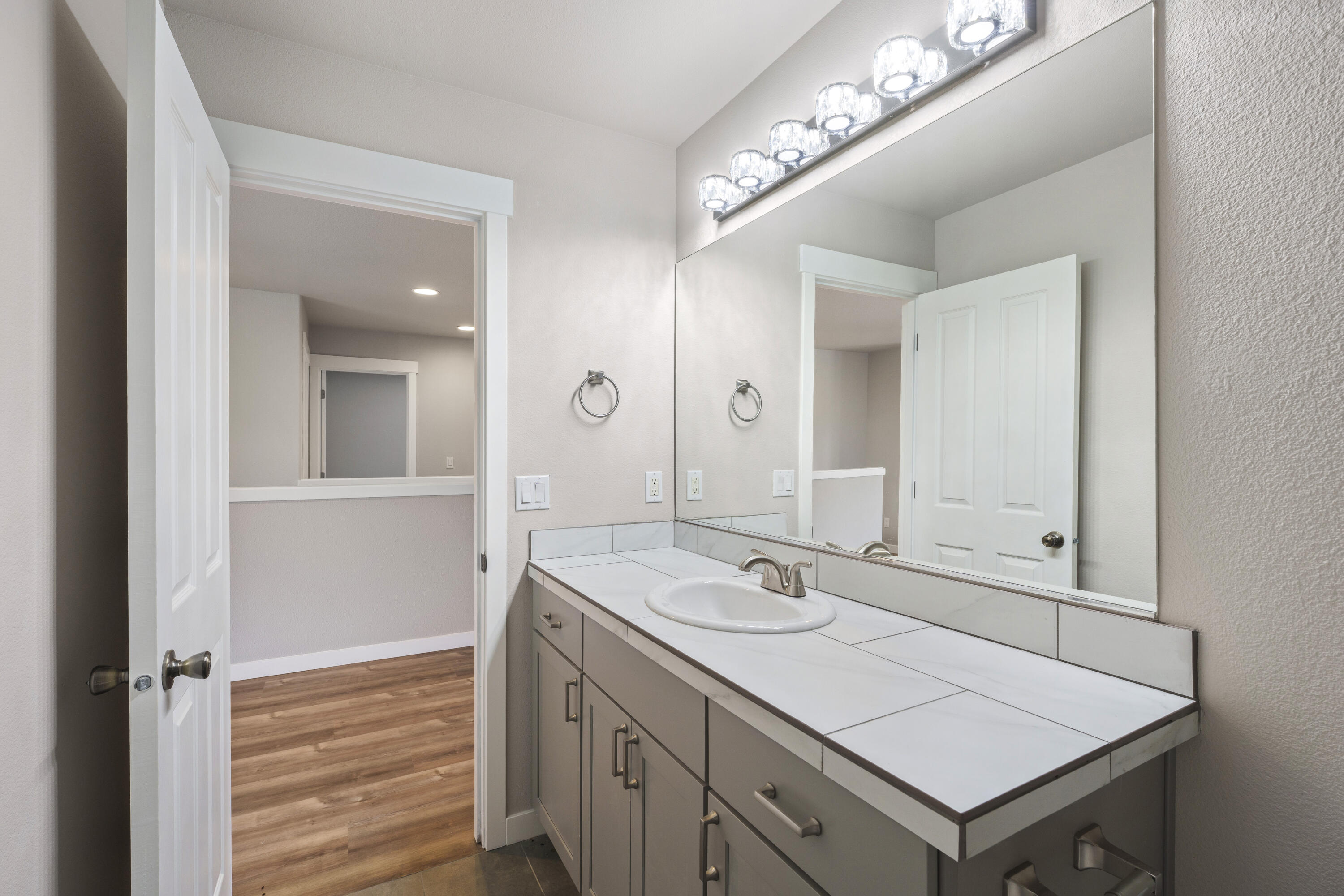 21189 Ritz Place Bend, OR 97702 - Photo 21 of 37 a bathroom with a sink vanity and a mirror