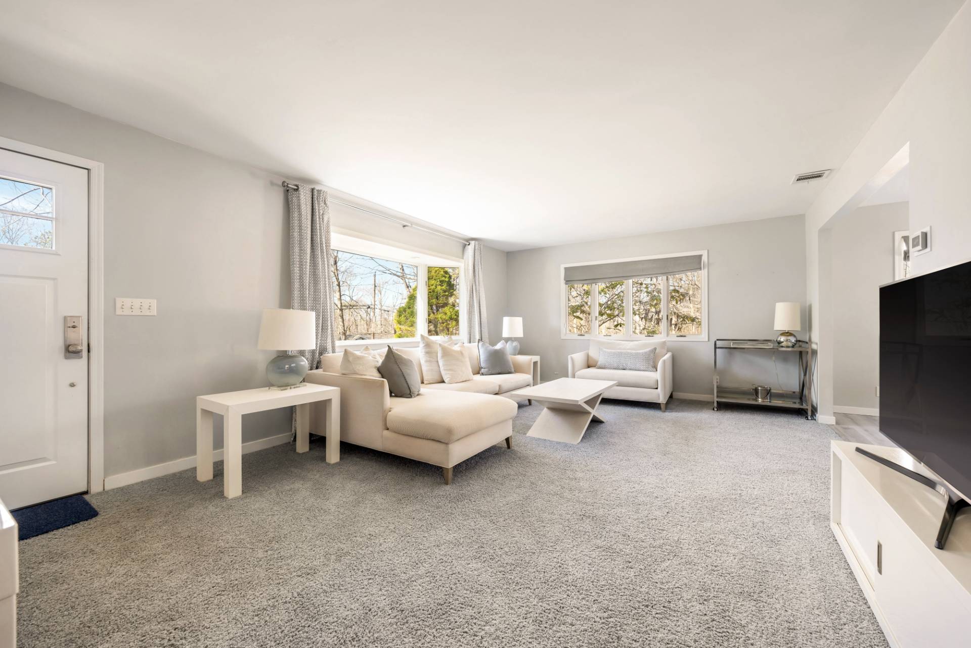20 Ridge Road West Sag Harbor, NY 11963 - Photo 3 of 12 a living room with furniture and a flat screen tv