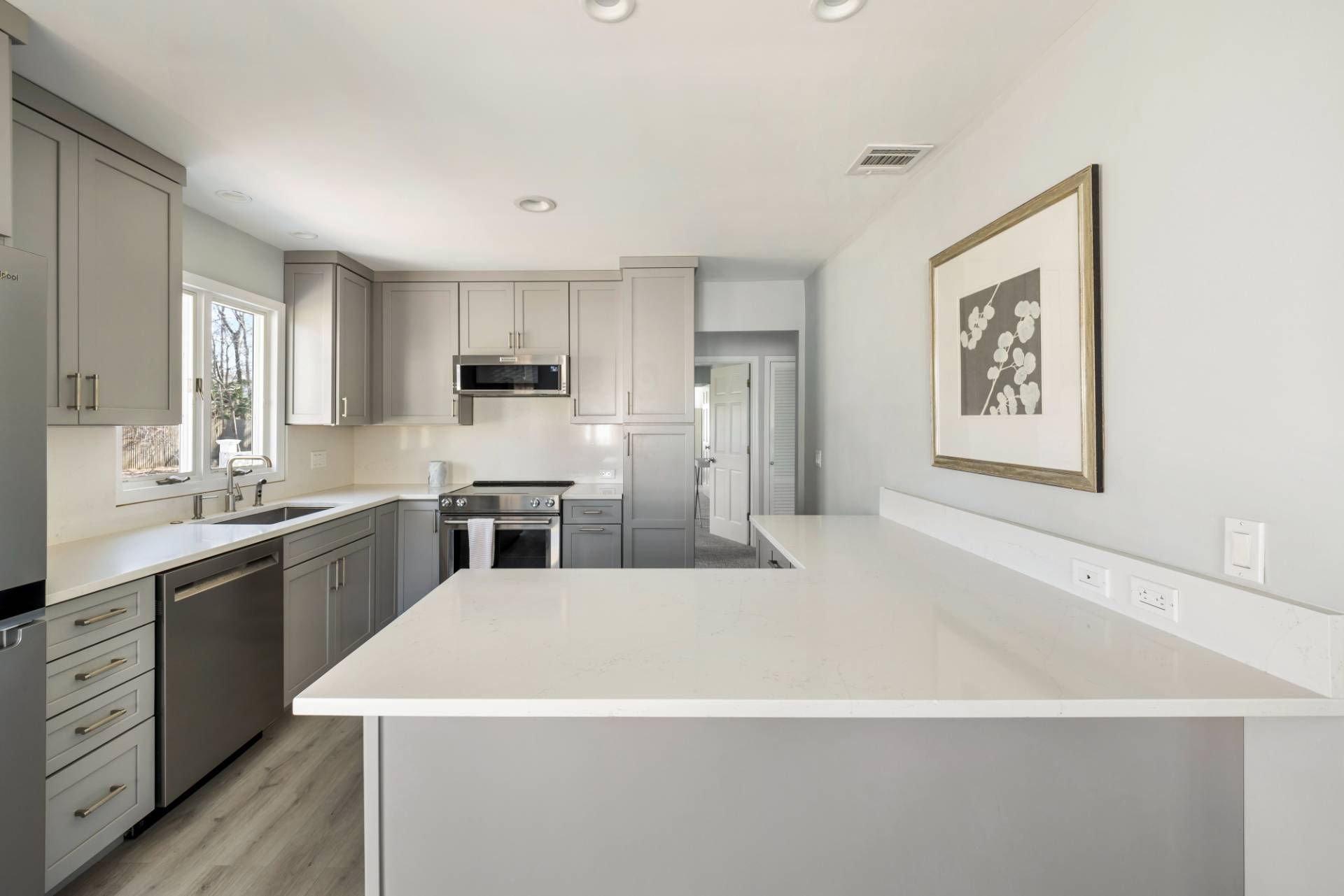 20 Ridge Road West Sag Harbor, NY 11963 - Photo 5 of 12 a kitchen with stainless steel appliances a refrigerator sink and stove