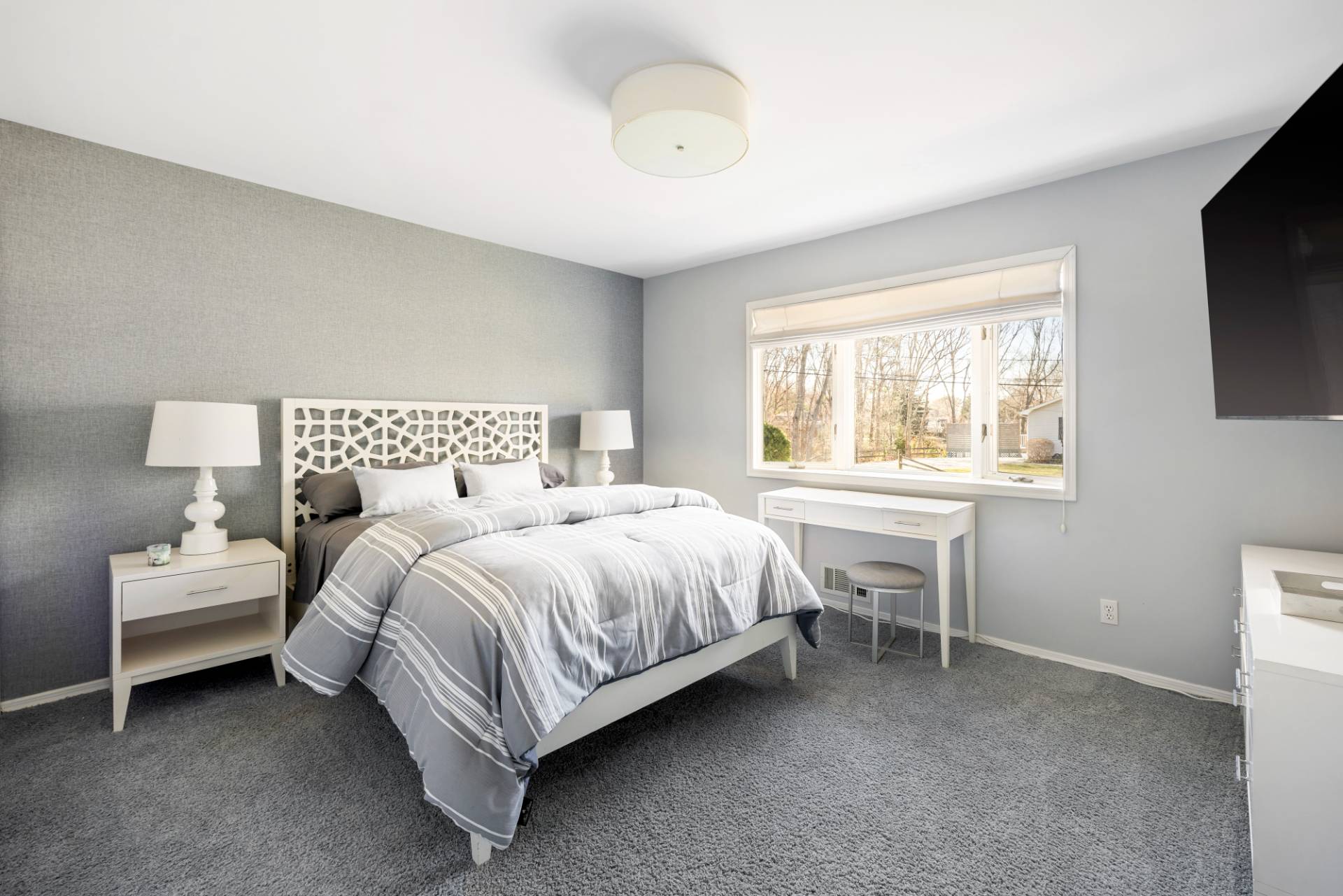 20 Ridge Road West Sag Harbor, NY 11963 - Photo 7 of 12 a bedroom with a bed and a television