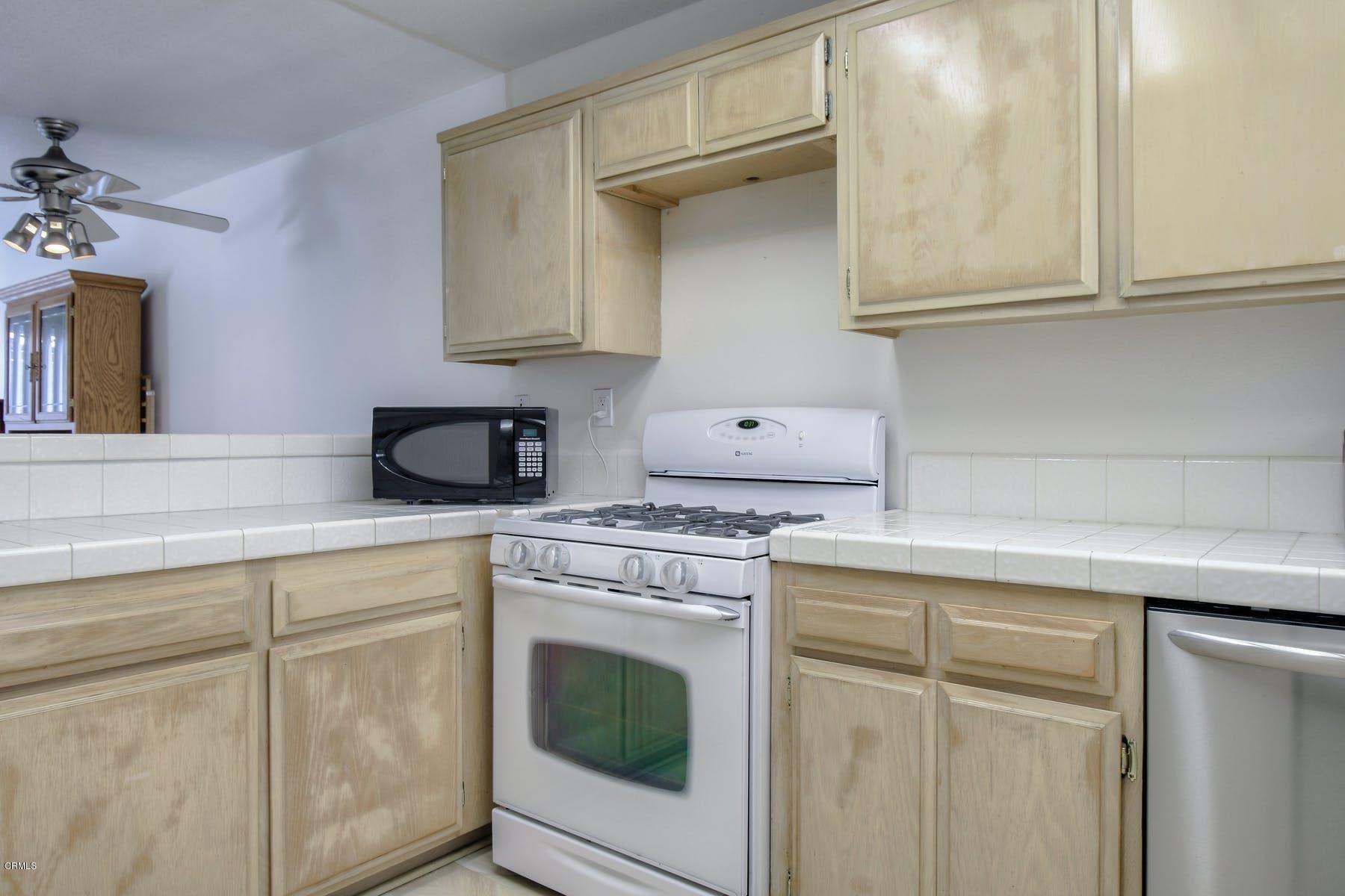 430 Percy Street Oxnard, CA 93033 - Photo 11 of 35 a kitchen with cabinets appliances and a sink