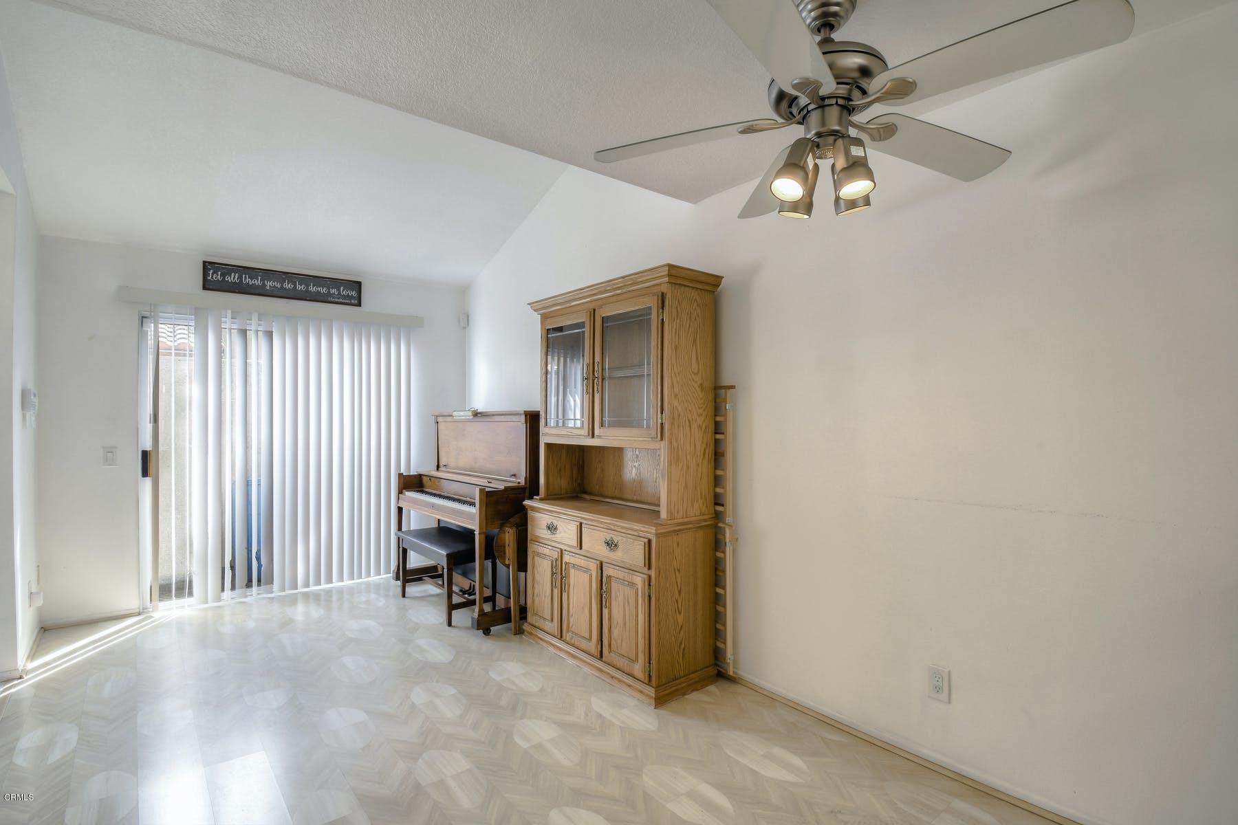 430 Percy Street Oxnard, CA 93033 - Photo 13 of 35 a view of a workspace with furniture and a chandelier fan