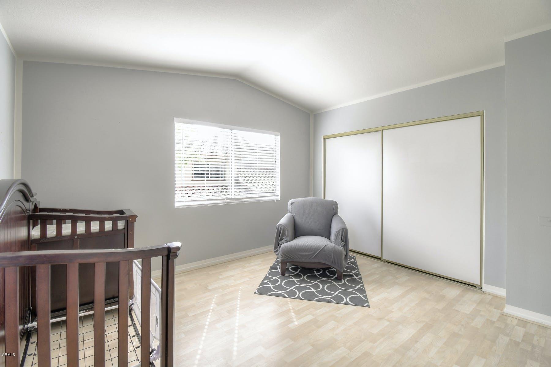 430 Percy Street Oxnard, CA 93033 - Photo 17 of 35 a bedroom with furniture wooden floor and window
