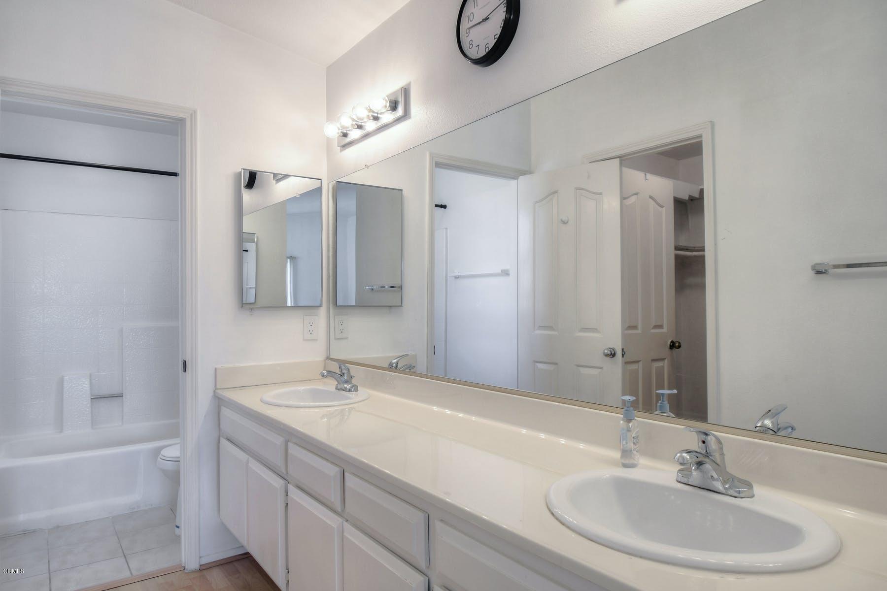 430 Percy Street Oxnard, CA 93033 - Photo 25 of 35 a bathroom with a sink double vanity granite tub and a mirror