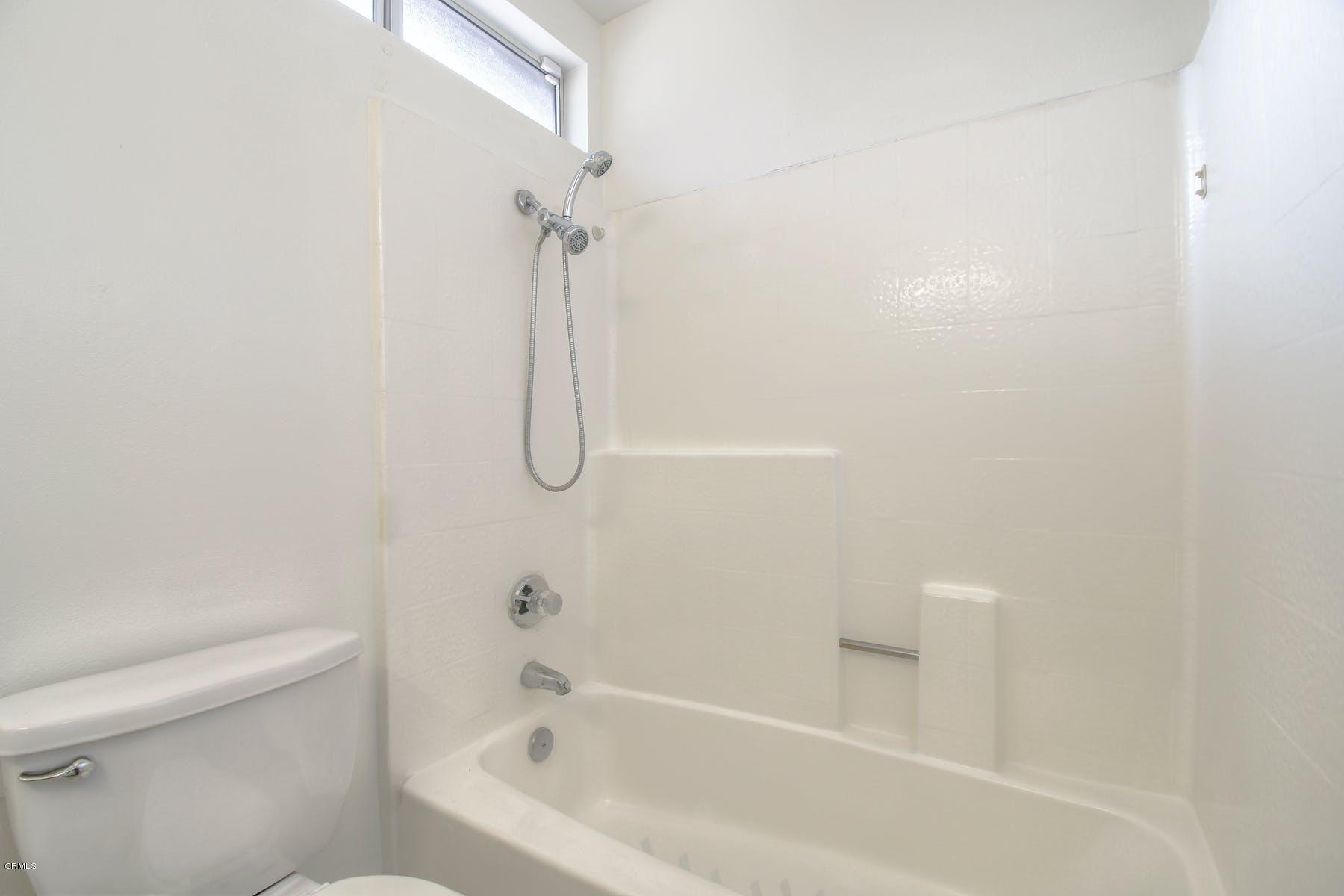 430 Percy Street Oxnard, CA 93033 - Photo 28 of 35 a bathroom with a bathtub and a toilet