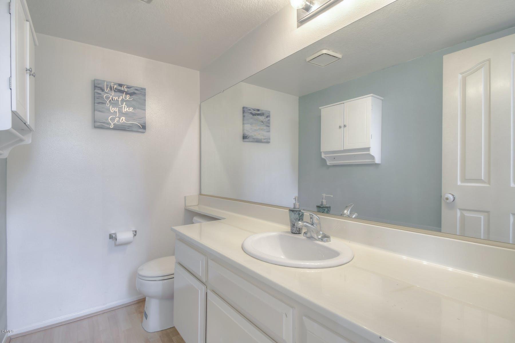 430 Percy Street Oxnard, CA 93033 - Photo 29 of 35 a bathroom with a sink and a toilet