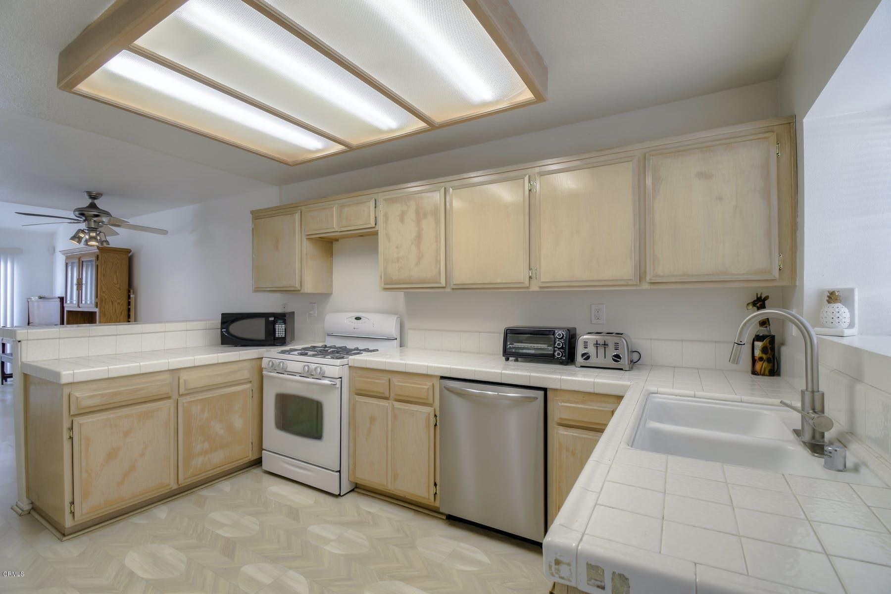 430 Percy Street Oxnard, CA 93033 - Photo 8 of 35 a kitchen with a sink and cabinets