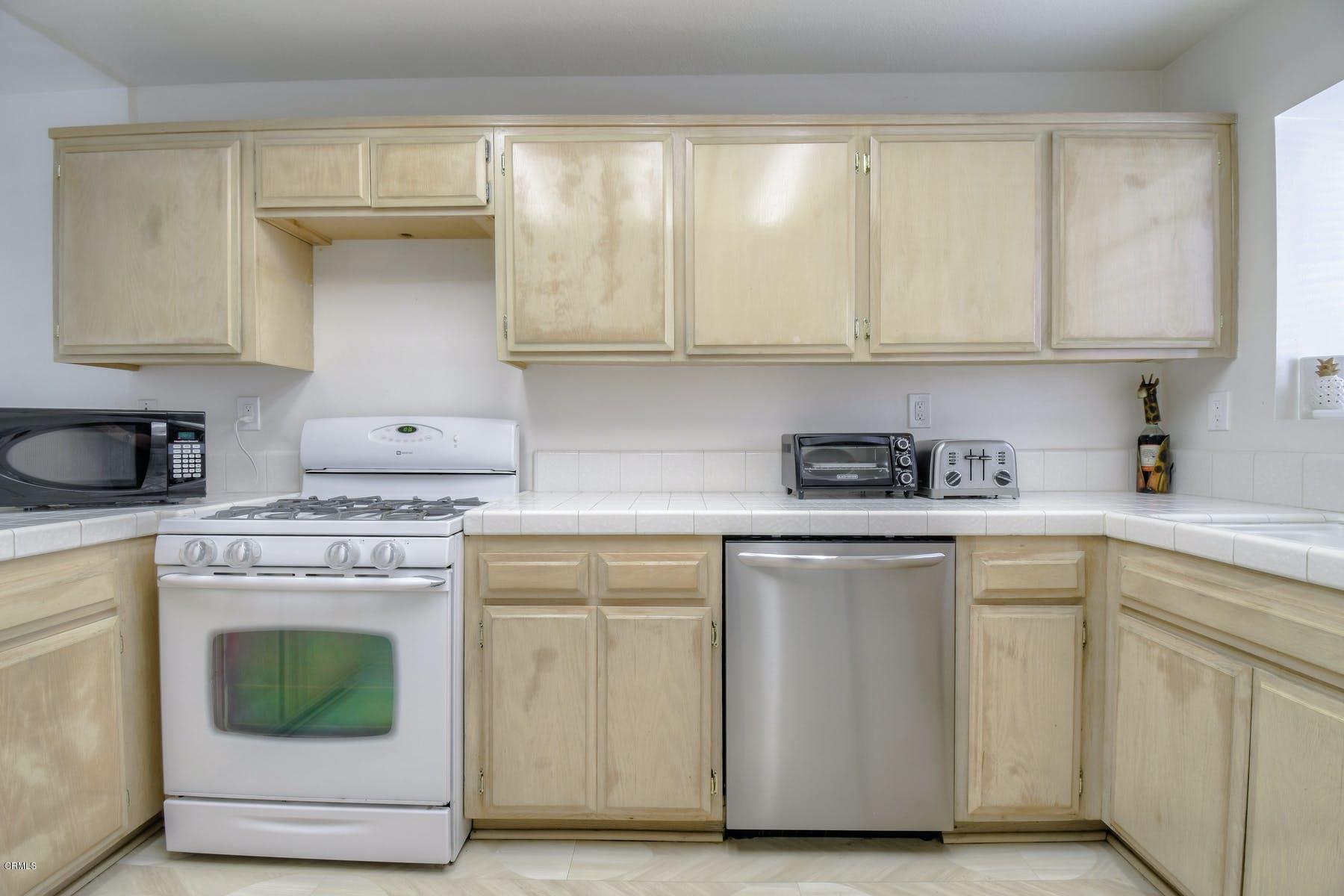 430 Percy Street Oxnard, CA 93033 - Photo 9 of 35 a kitchen with cabinets appliances and a sink