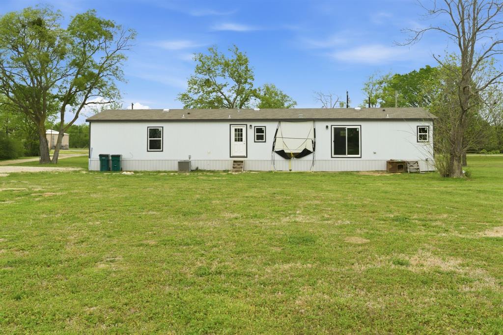 8792 Highway 67 Saltillo, TX 75478 - Photo 6 of 40 a view of a house with a yard