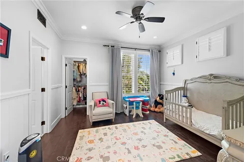 a bedroom with furniture and a window