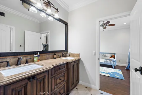 a bathroom with a sink double vanity and a mirror