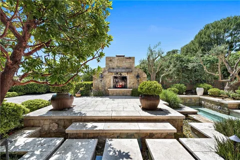 a view of a house with potted plants
