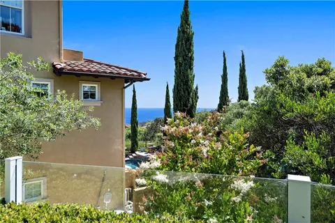 a view of a house with a small yard and plants