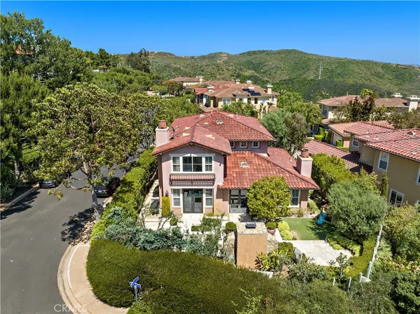 an aerial view of a house with a garden