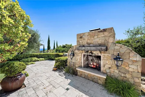 a building outdoor space with patio furniture and potted plants