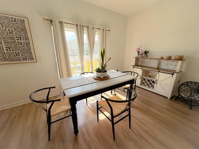 a view of a workspace with furniture and window