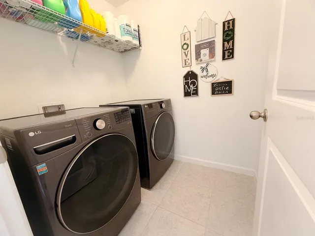 a utility room with dryer and washer