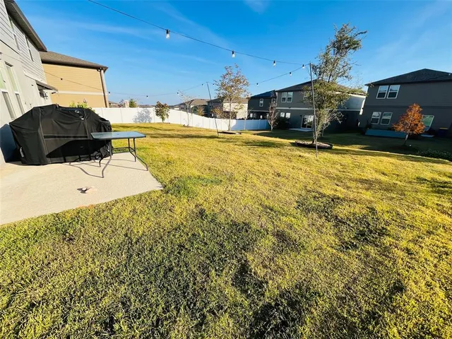 a swimming pool view with a seating space