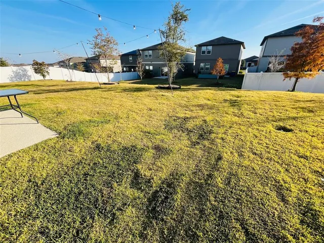 an outdoor space with furniture and umbrella