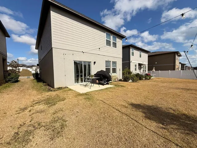 a view of a house with a snow in the yard
