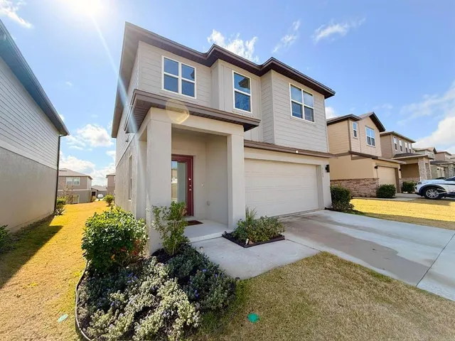 a front view of a house with swimming pool