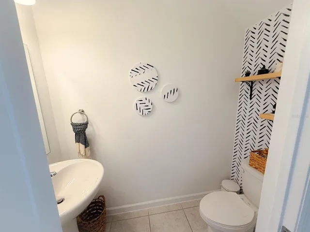 a bathroom with a toilet and a sink