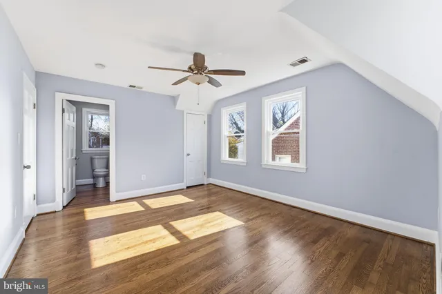 a view of an empty room with empty shelves