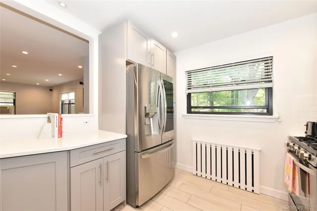 a kitchen with stainless steel appliances a refrigerator and a sink