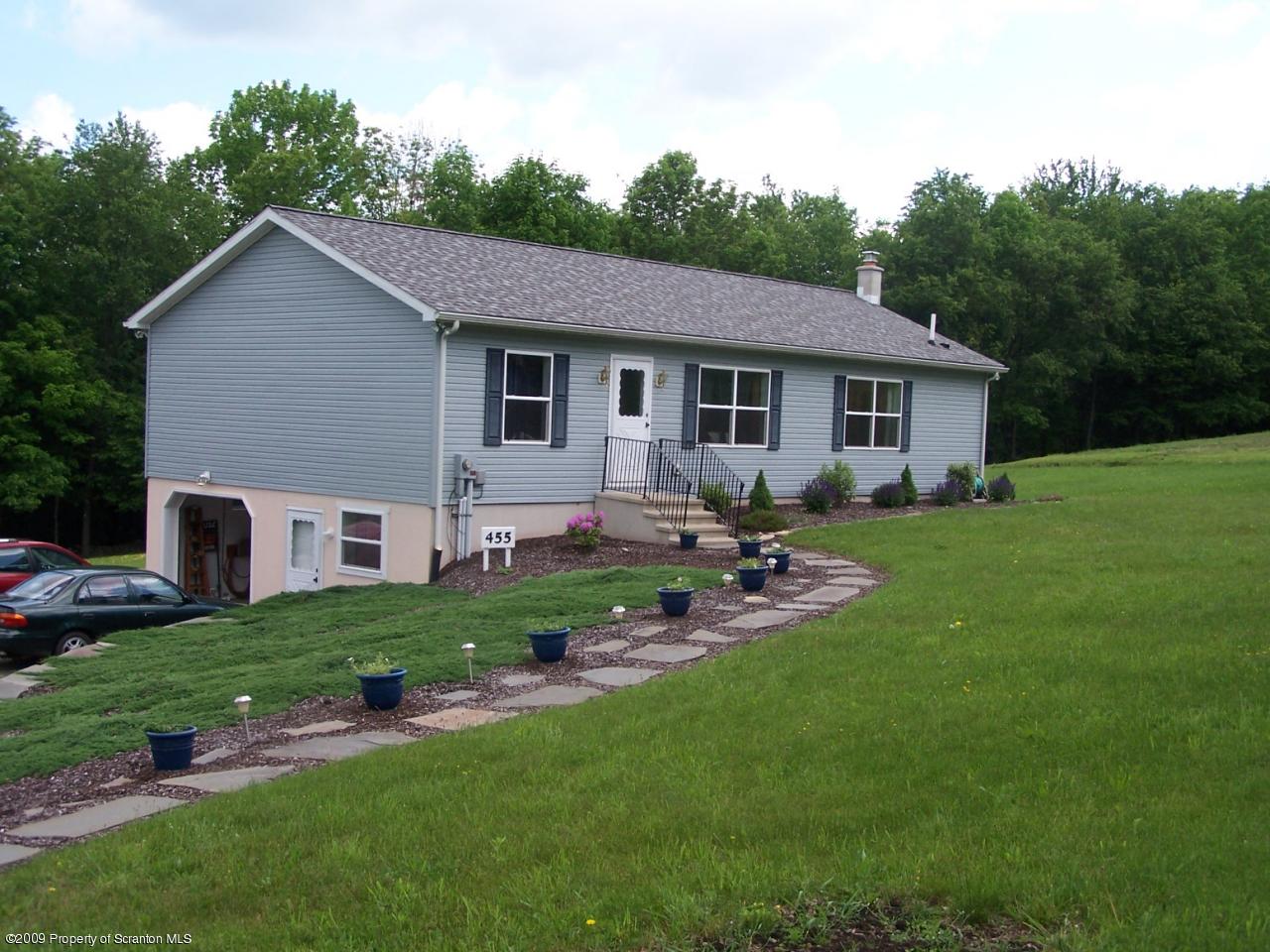 455 Maple Grove Road Factoryville, PA 18419 - Photo 16 of 16 a backyard of a house with table and chairs