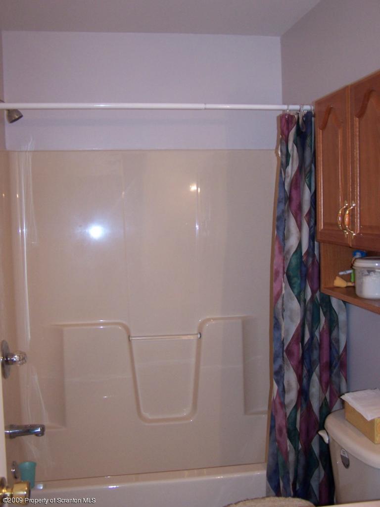 455 Maple Grove Road Factoryville, PA 18419 - Photo 8 of 16 a bathroom with a shower
