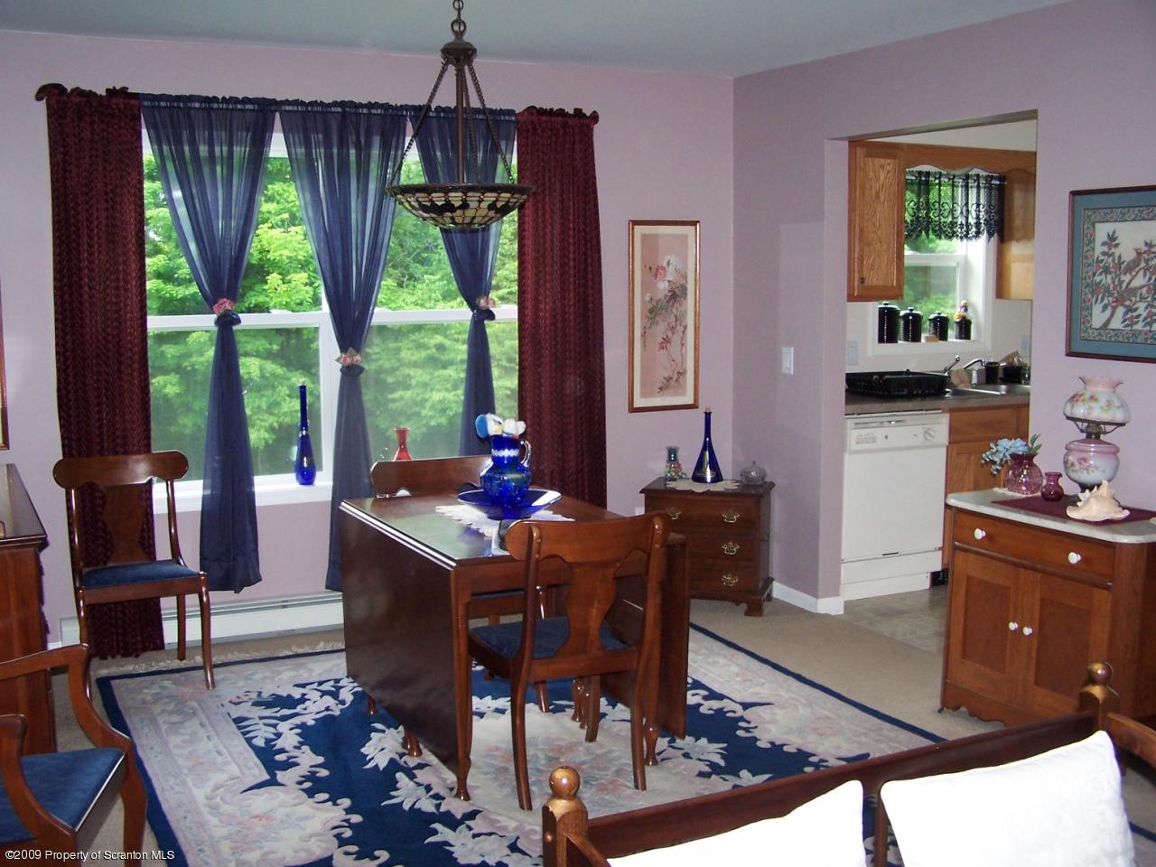 455 Maple Grove Road Factoryville, PA 18419 - Photo 9 of 16 a view of a dining room with furniture window and outside view