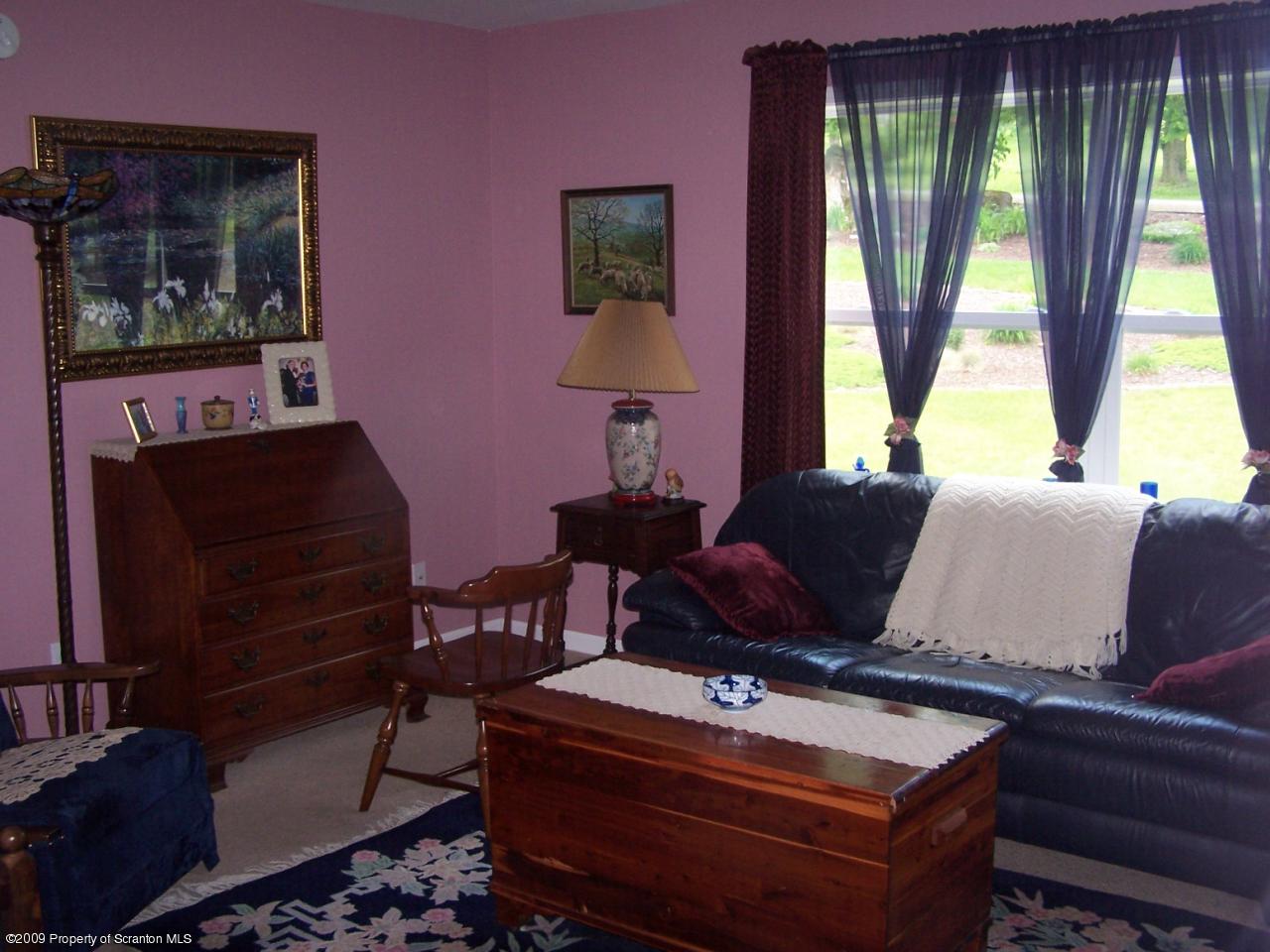 455 Maple Grove Road Factoryville, PA 18419 - Photo 10 of 16 a living room with furniture and a window