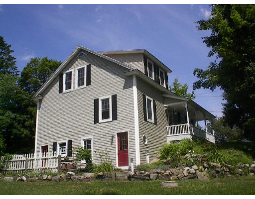40 Bunyan Road Monson, MA 01057 - Photo 1 of 15 a front view of a house with a yard
