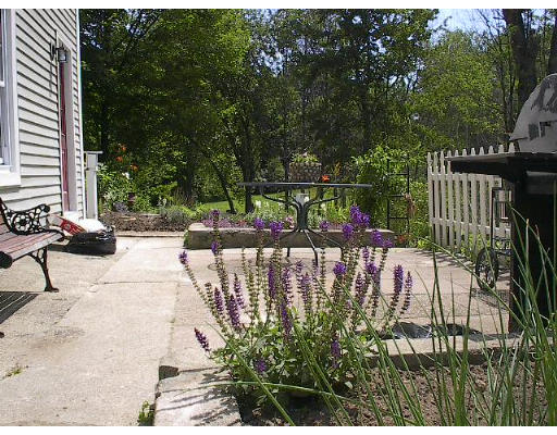 40 Bunyan Road Monson, MA 01057 - Photo 13 of 15 a view of swimming pool with lawn chairs and plants