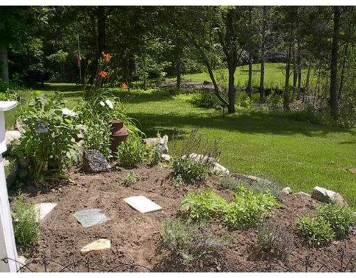 40 Bunyan Road Monson, MA 01057 - Photo 15 of 15 a view of a garden with large trees