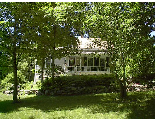 40 Bunyan Road Monson, MA 01057 - Photo 5 of 15 a view of a house with a big yard and large trees