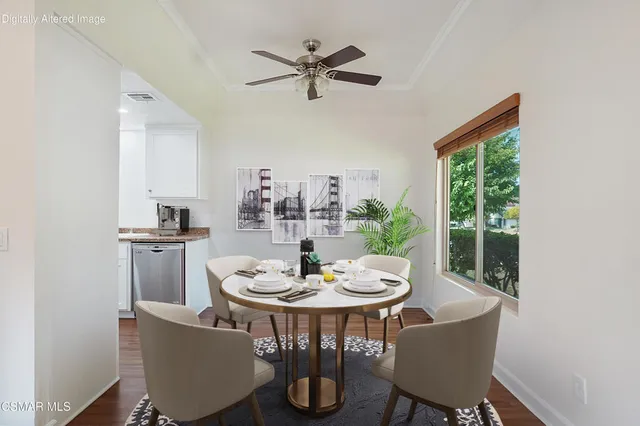 a dining room with furniture a window and wooden floor