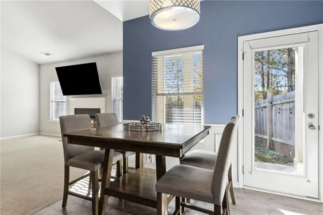 a kitchen with kitchen island granite countertop a sink appliances and cabinets