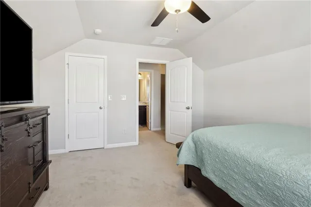 a bathroom with a sink a toilet and shower curtain