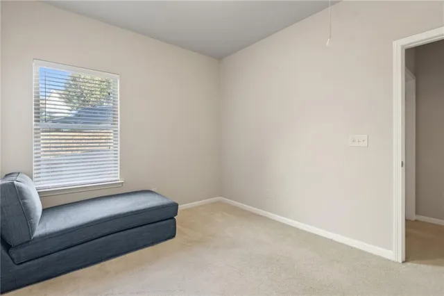 a utility room with cabinets and washer