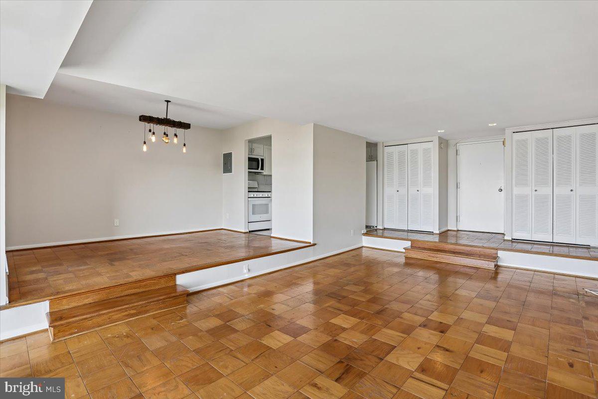 9900 Georgia Avenue, Unit 27613 Silver Spring, MD 20902 - Photo 14 of 47 Step down to Living Room