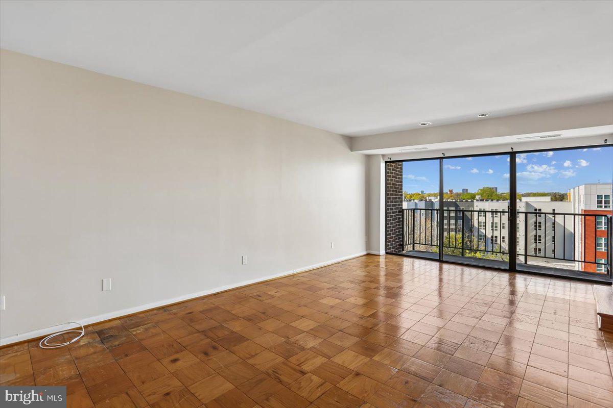 9900 Georgia Avenue, Unit 27613 Silver Spring, MD 20902 - Photo 17 of 47 Living Room with sliding glass door to the balcony