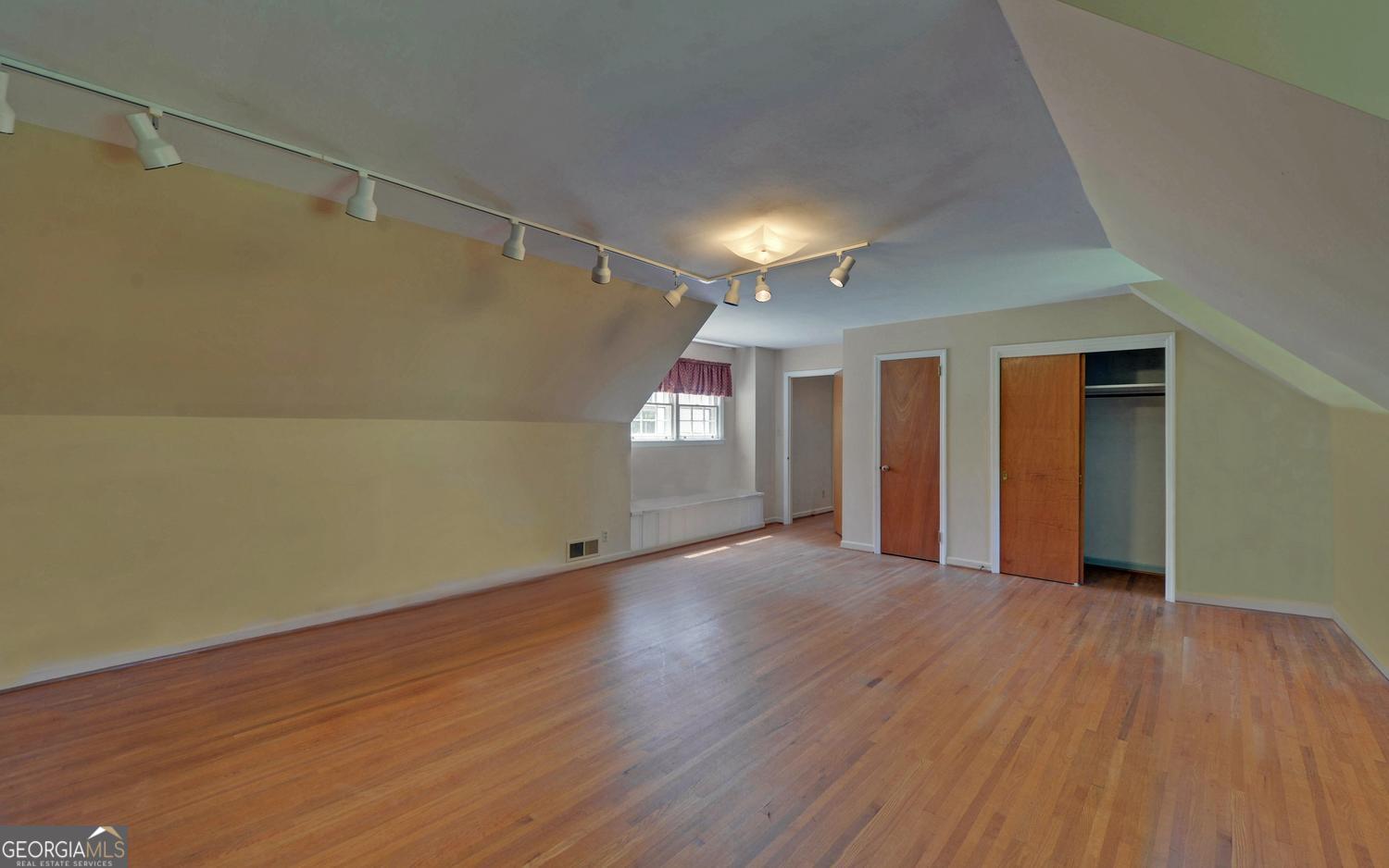 400 Harris Street Toccoa, GA 30577 - Photo 30 of 49 a view of an empty room with wooden floor and closet