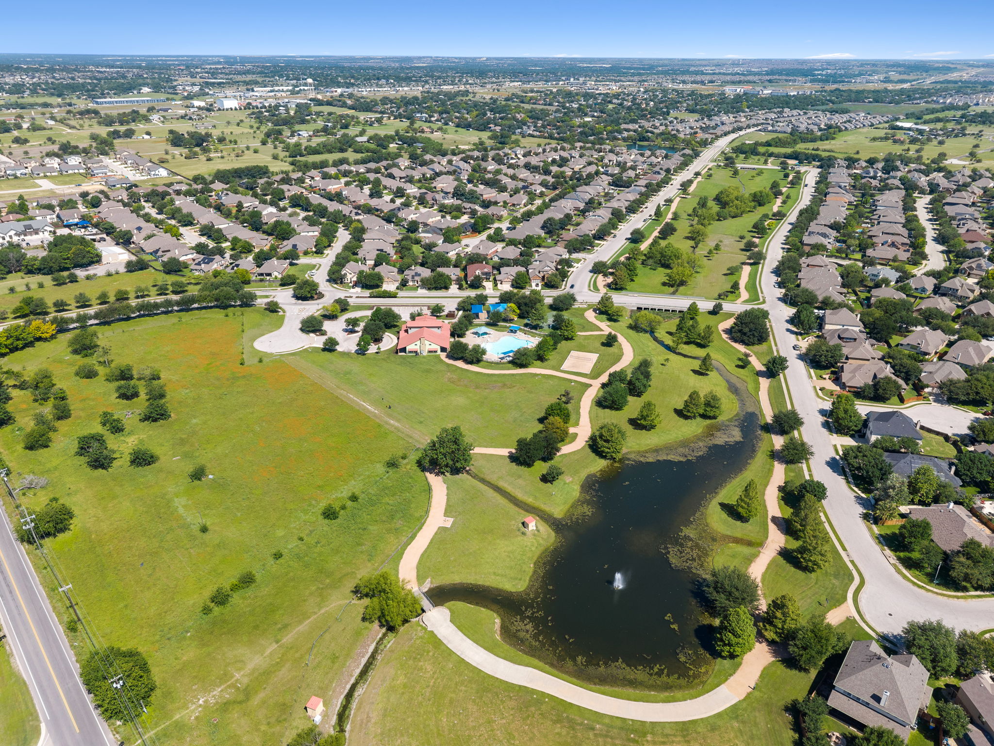 3101 Fresh Spring Road Pflugerville, TX 78660 - Photo 36 of 39 Aerial perspective showcasing the community's abundant green spaces, trails, and ponds for fishing.