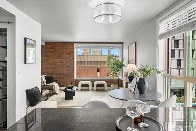 a living room with furniture and a potted plant