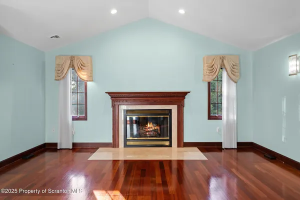 a view of a dining room with furniture and chandelier