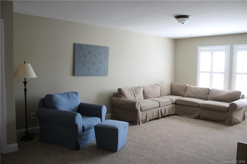 724 Revival Row Fort Mill, SC 29708 - Photo 14 of 15 a living room with furniture and a window